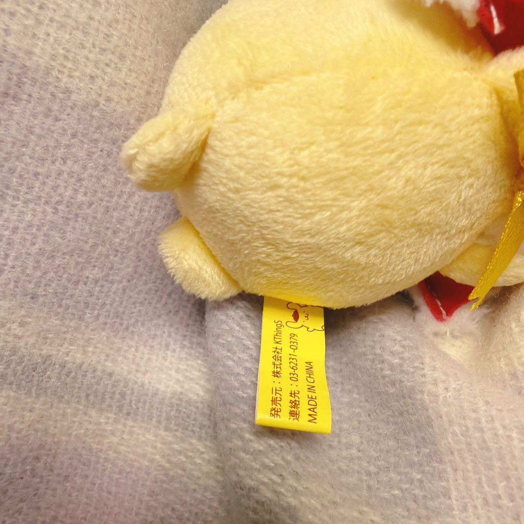 ポムポムプリンカフェ　マスコット　マフィンと寝てる