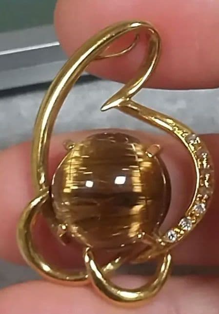 14.50ブラウンルチルキャッツアイダイヤ0.07入りk18ペンダントトップ