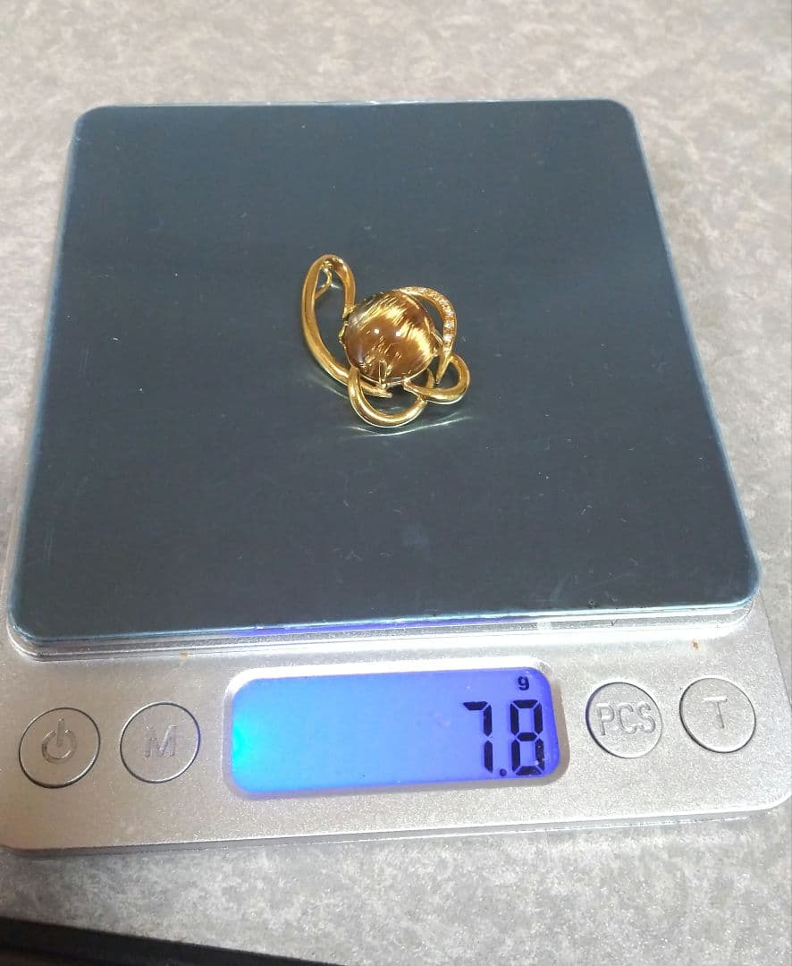 14.50ブラウンルチルキャッツアイダイヤ0.07入りk18ペンダントトップ