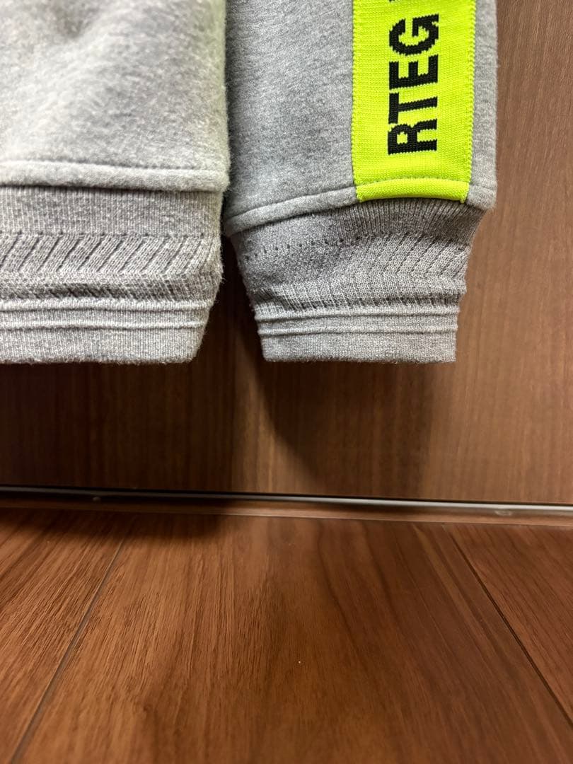 RTEG アダムスジャグラー グレー ジップパーカー Sサイズ 蛍光イエロー