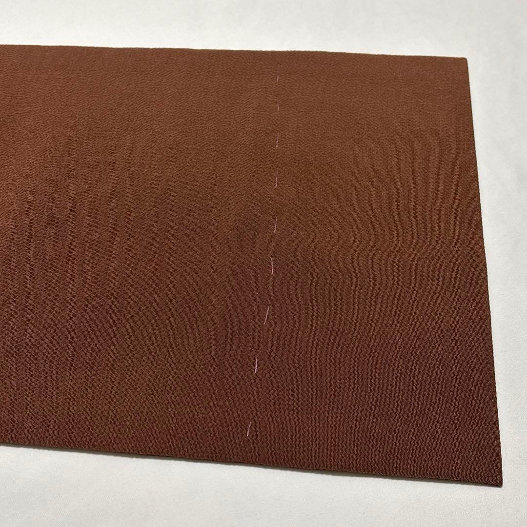 開き名古屋帯【栗山吉三郎】和染紅型 縮緬 垣根文様 茶色 お太鼓柄 正絹 九寸帯