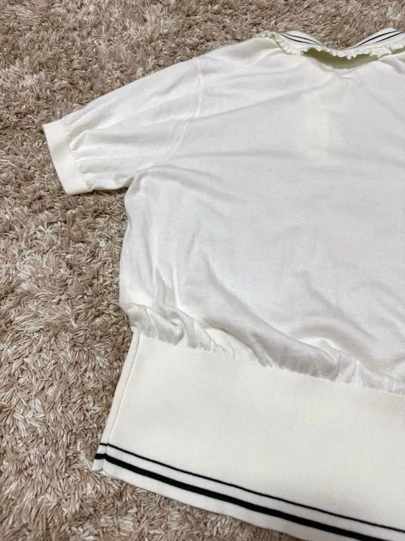 yori ミニフリルポロニット