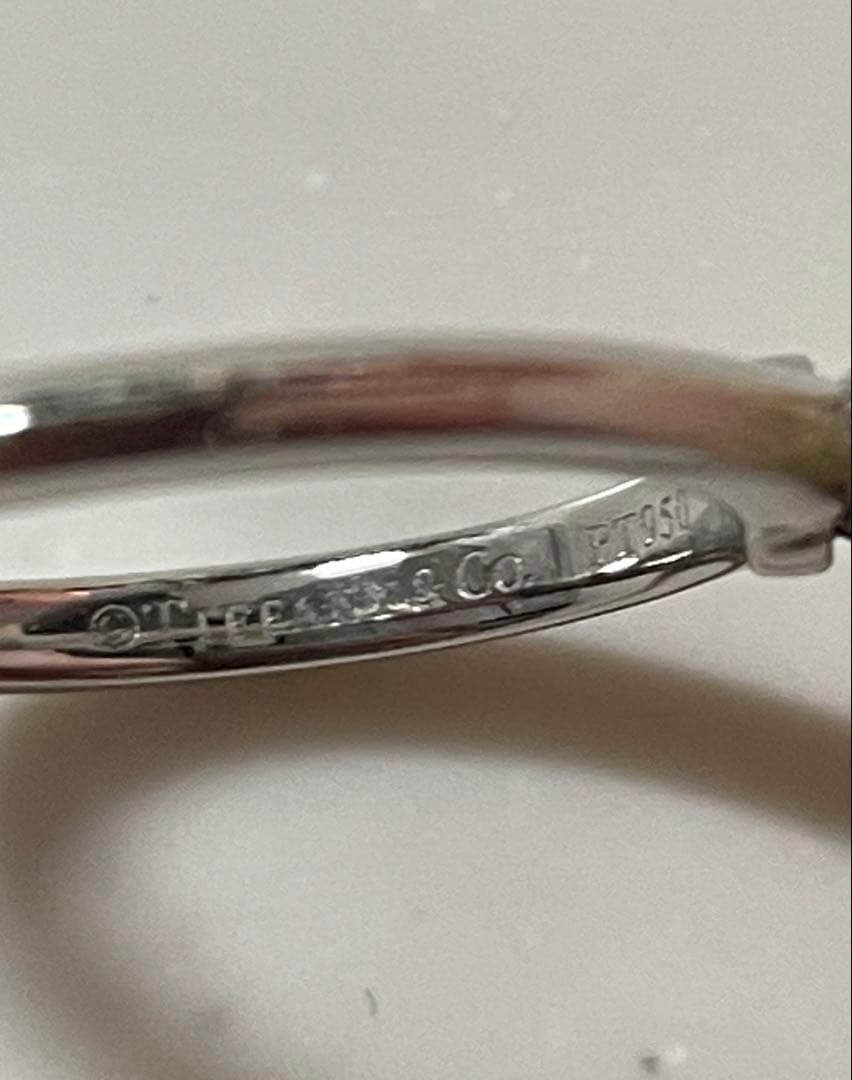 新品仕上げ　TIFFANYソリティアリング 0.18ct 13号弱　鑑定書付き