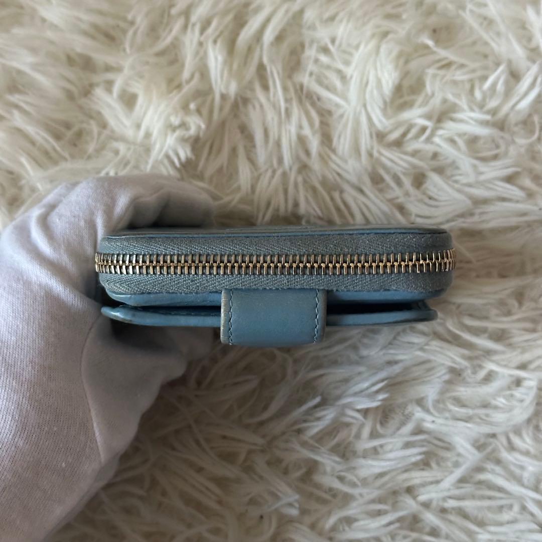 イヴサンローラン 二つ折り財布 型押し レザー ジップ ライトブルー コンパクト