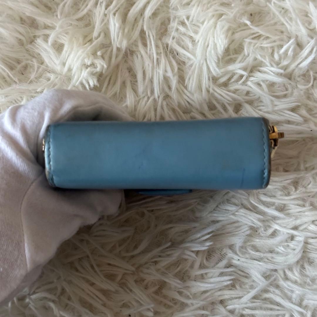 イヴサンローラン 二つ折り財布 型押し レザー ジップ ライトブルー コンパクト