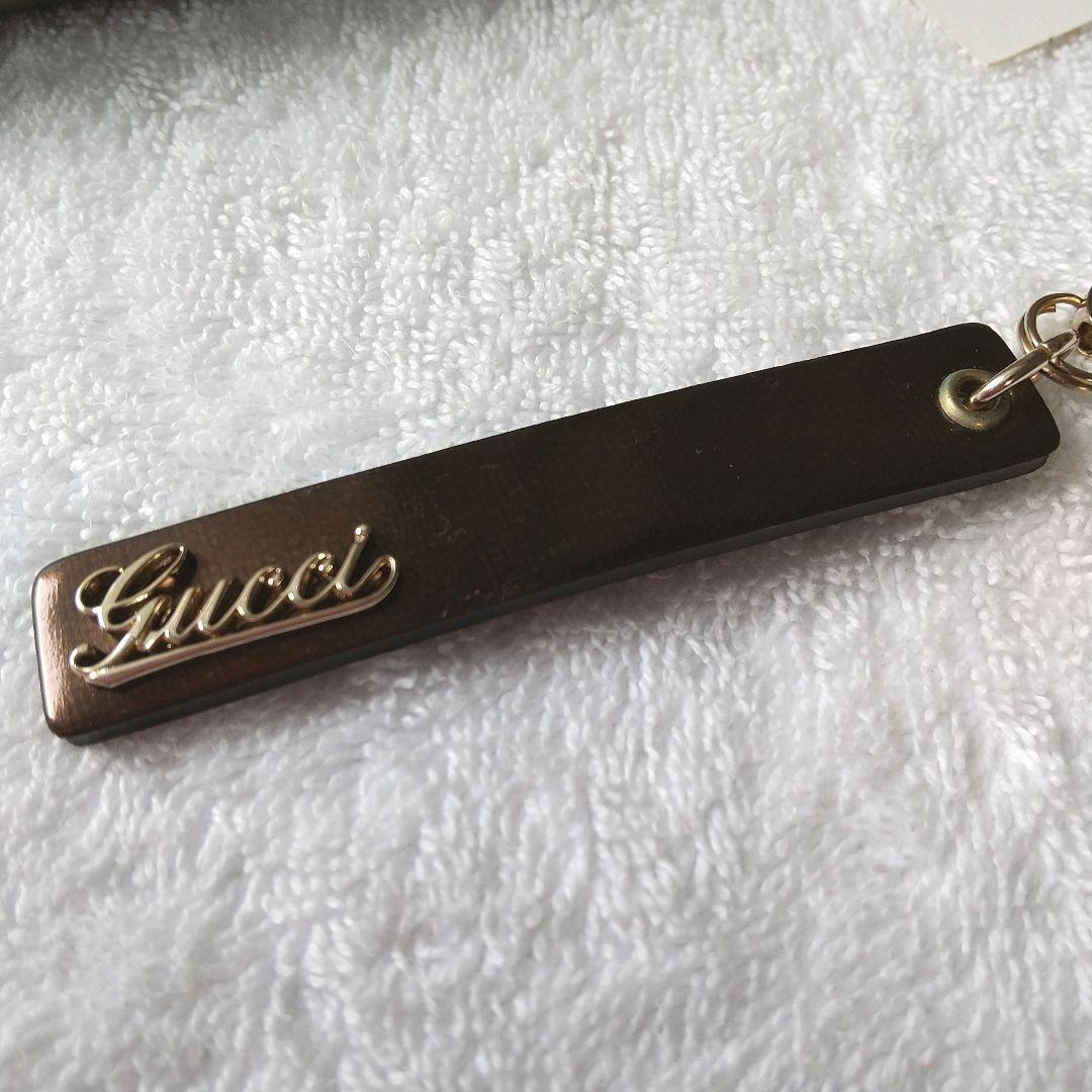 【新品 】 グッチ ストラップ GUCCI 筆記体ロゴ レザー 廃盤 ゴールド