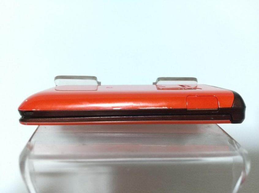 GRATINA KYY06 折りたたみ式携帯電話 オレンジ