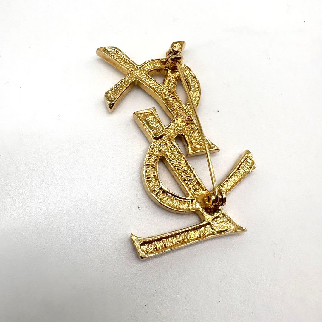 【極美品 】イヴサンローラン ブローチ カサンドラ ロゴ YSL ゴールド 人気